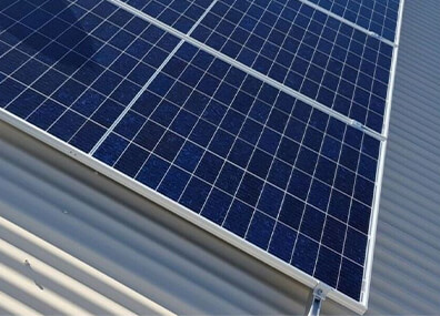Understand the Risks of Adding Weight to Your Carport or Shed. solar panels on a Professional Choice Custom Steel Sheds