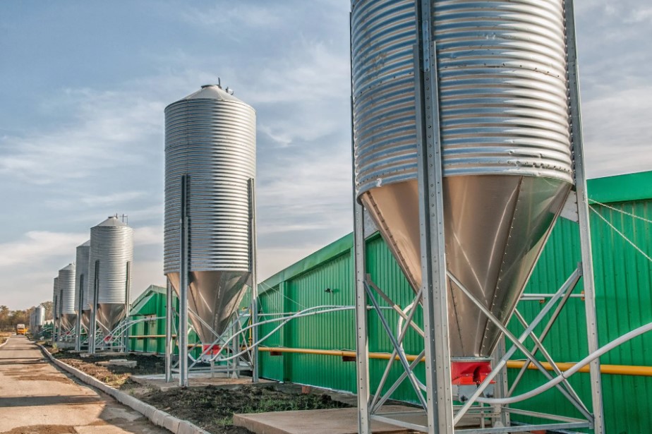 Custom farm & rural sheds - photo of a shed with a silo outside