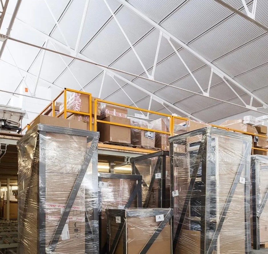 Packing shed interior with pallets of goods.