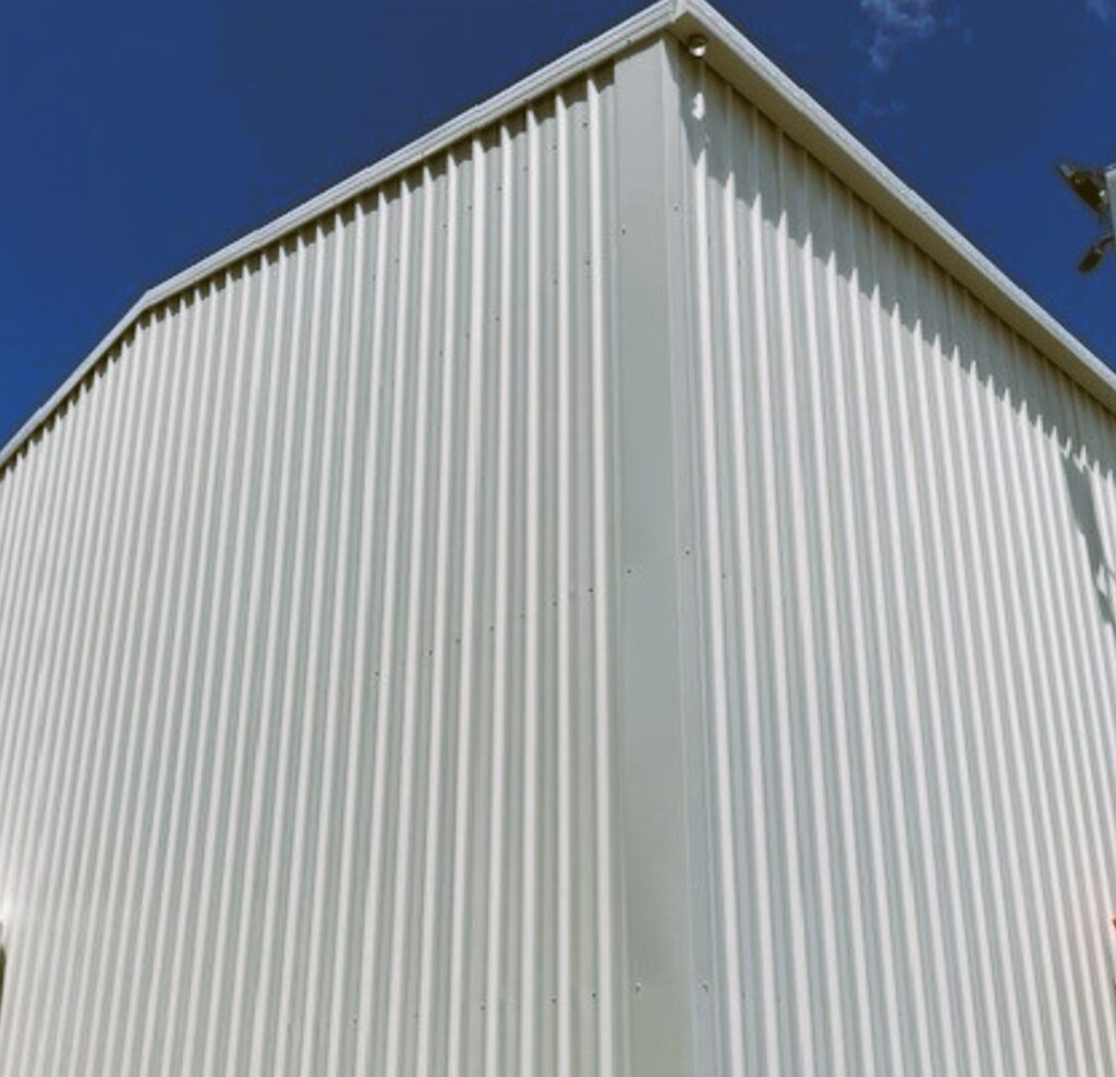 Custom Made Steel Sheds photo showing corner of a large shed