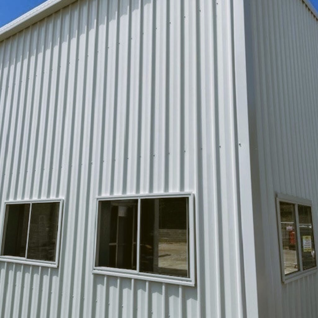 Custom made industrial sheds showing a large shed with side windows.